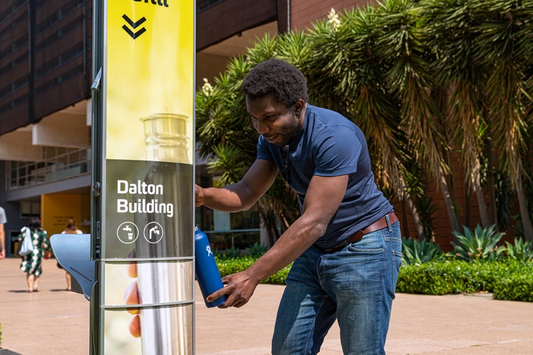 UNSW student uses bubbler on campus 