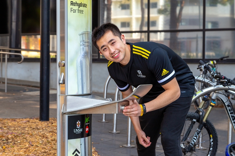 UNSW student drinking from water bubbler