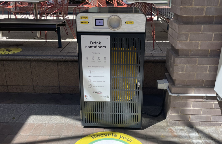 white bin that recycles bottles and cans