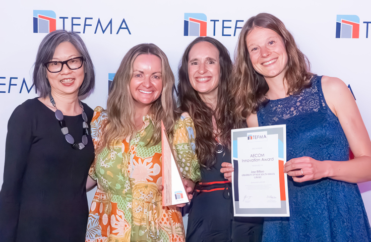 4 women receiving the award certificate